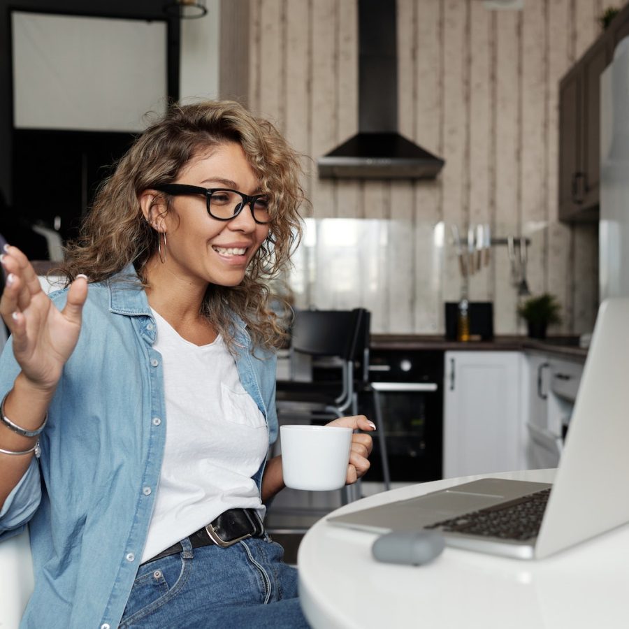 Woman Using Laptop Doing A Video Call